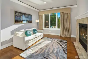 Primary retreat sitting area with fireplace