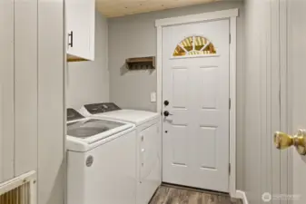 Utility room with separate entrance to outside.