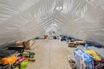 Twenty-two solar panels are mounted directly on the garage, and insulated attic storage adds even more functional space. (attic space)