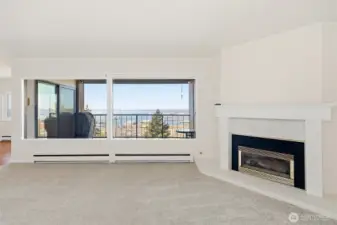 Spacious living room w/natural gas fireplace and views of Bellingham Bay, mountains and islands