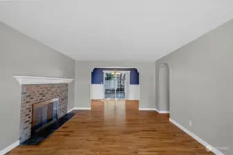 Refinished real hardwood floors,Cozy Fireplace and open floor plan leading through archways to dining room and French doors that open up to the big fully fenced back yard.