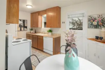 Kitchen of unit 2218, with a side door entrance to the back.