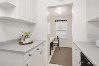 There is a bonus room/den adjacent to the kitchen. This would make a great office space or you could turn it into your laundry area.