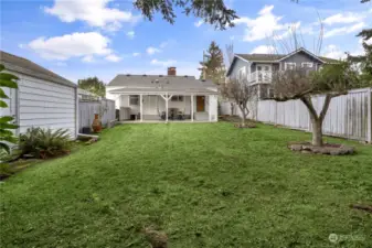 Spacious 5,191 square foot lot provides lots of space for outdoor activities. There is also a storage shed to the left, on the south side of the garage.