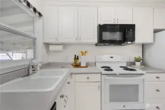 The kitchen includes refrigerator, stove, dishwasher and microwave.