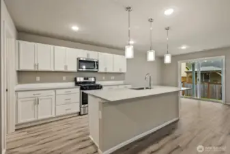 Open concept living/dining/kitchen-Interior Pictures: Disclaimer- Photos are of another Finley floor plan from a previous community, photos are for illustrative purposes only. Finishes, flooring, upgrades, or other features may vary.
