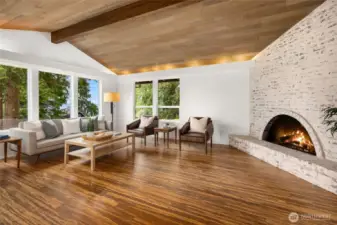Stylish wood buring, brick fireplace.