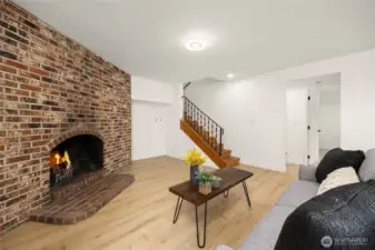 Downstairs, it a bonus! Big bonus room with fireplace, home office and another bedroom.