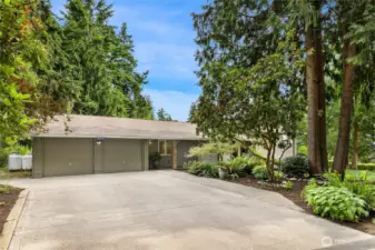 The over size garage has room for 3 cars and has a work bench for thse small projects.   Huge concrete driveway for overflow parking.