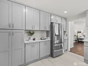 A floor to ceiling pantry along with the coffee/tea nook allows for a plethora of storage.