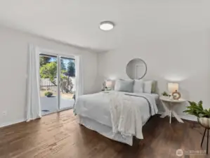 The primary bedroom provides access to the back deck.