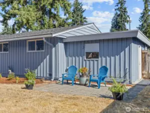 The paver patio on the other side of the garden could be used for an outdoor table and grilling spot.