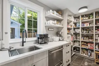 TONS of storage space, a second dishwasher, and prep sink are all hidden in here - how cool!
