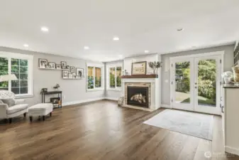 This family room is huge! Flow easily out onto the patio through the French doors on the right.