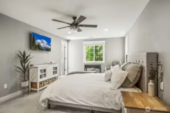 Head upstairs to see all four bedrooms, including this bright and airy primary suite.