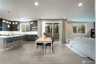 Wow! Wow! Wow! Walk into your expansive kitchen and eating area with room for lots of entertaining or just quaint nights at home. HUGE island with quarts and tons of storage in the plethora of cabinets.