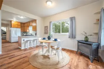 Cozy gas fireplace in corner of dining space
