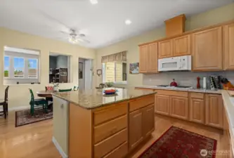 The oversized island is a real functional centerpiece to this space.  This makes entertaining and everyday cooking a breeze.  You know what they say, everyone always ends up in the kitchen and this one has the space to handle it!