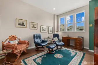 At original construction this space could have been a second garage.  The owners decided to upgrade to this fabulous sitting room.  Use it the same way, or maybe a nice home office?