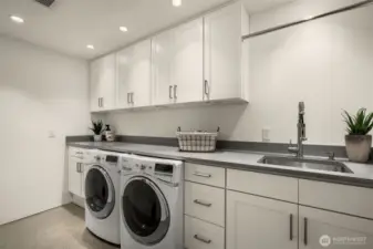 Laundry reimagined: light-filled, spacious, and sleekly organized.
