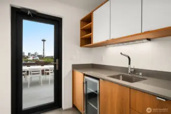 Anticipation, drawing you upward to the crown jewel of the home: a rooftop sanctuary with sweeping city views.
