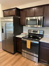 Side by side stainless steel refrigerator with ice and water in door.