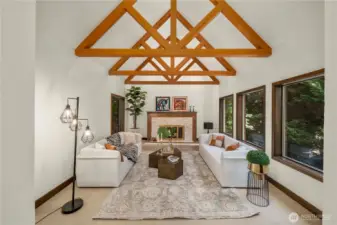 The living room showcases fine wood framing and rich architectural detail
