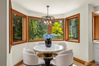 Cozy breakfast nook just off the kitchen, offering an intimate space for everyday dining and relaxed conversations.