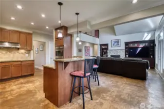 Open concept kitchen with seating available at the counter.