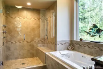 Primary bathroom with jetted soaker tub and extra large shower.