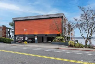 The architecturally distinctive 733 Lake Street S makes an immediate impression with its bold copper-toned corrugated exterior and clean modern lines, sitting directly on the shores of Lake Washington. Ideally positioned within the building for privacy and tranquility, with covered parking and just steps from Kirkland's vibrant waterfront dining, boutique shopping, parks, and the beloved David E. Brink Park pier — this is downtown Kirkland waterfront living at its finest.
