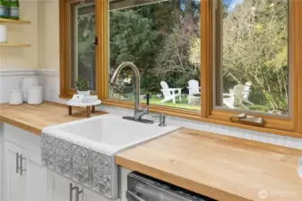 The kitchen sink is a work of art and has the best view out to the spring blossoms.