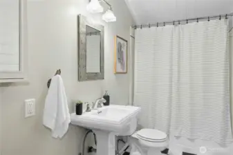 The main hallway bathroom with a tub/shower combo and updated fixtures.