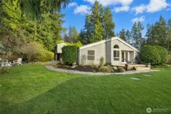 Ample room and sun here for a serious gardener. The property was once owned by a master gardener and has wonderful mature plantings.