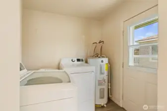 mud room/laundry room with door to backyard.