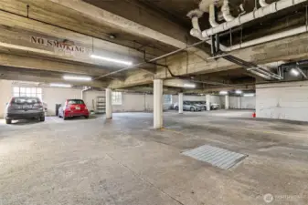 Parking garage with dedicated spot. Unit parking is the middle of the 3 cars on the right. Currently leased to a neighbor.