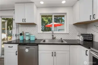 Easy access to the deck and dining is to the left of the kitchen