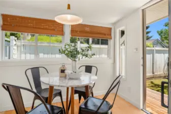 The back dining room opens up to a new cedar barbecue deck.