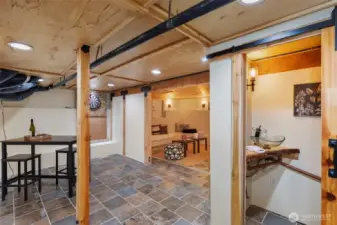 Another view of the basement with the half bath off to the right.