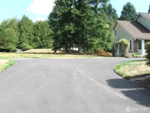 Spacious drive features a turn-around area.  To the south of the site is an RV  parking area