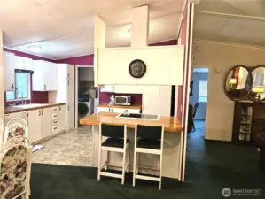 Just off the dining area, a convenient eating bar offers additional seating and a great spot for casual meals.