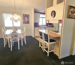 Just off the dining area, a convenient eating bar offers additional seating and a great spot for casual meals.