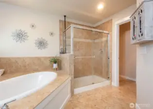 Primary suite with a water closet and walk in closet.