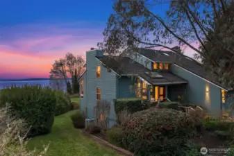 Beautiful evening exterior highlighting the home’s peaceful setting and scenic backdrop.