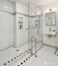 Updated bathroom with walk-in shower, modern fixtures, and clean, bright finishes.
