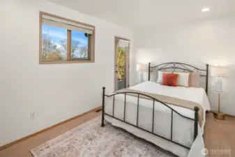 Comfortable bedroom with natural light, neutral tones, and serene ambiance.