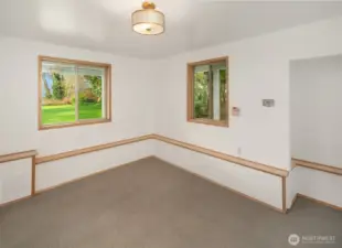 Versatile bonus room ideal for office, studio, or additional living space.