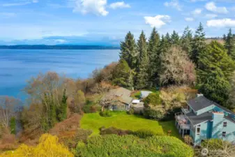 Elevated view of the property overlooking the water, capturing the beauty of the Vashon Island coastline.
