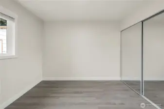 Bedroom #3. Mirrored closet doors, new flooring, paint, fixtures