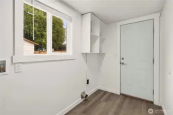 Utility room with door to backyard